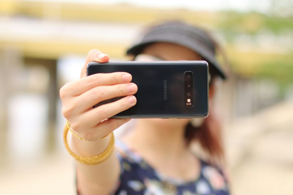 A woman takes a selfie