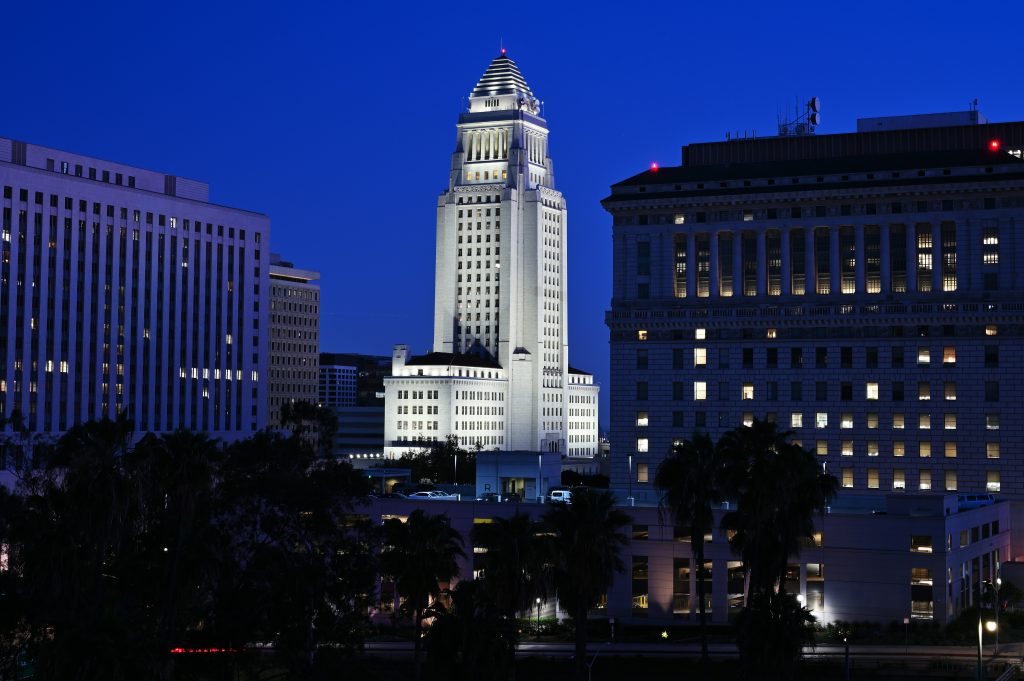 Los Angeles City Hall — illuminated by light at night. Recently Democracy Without Elections succeeded in bringing sortition to L.A. for charter reform. Photo by Miad.