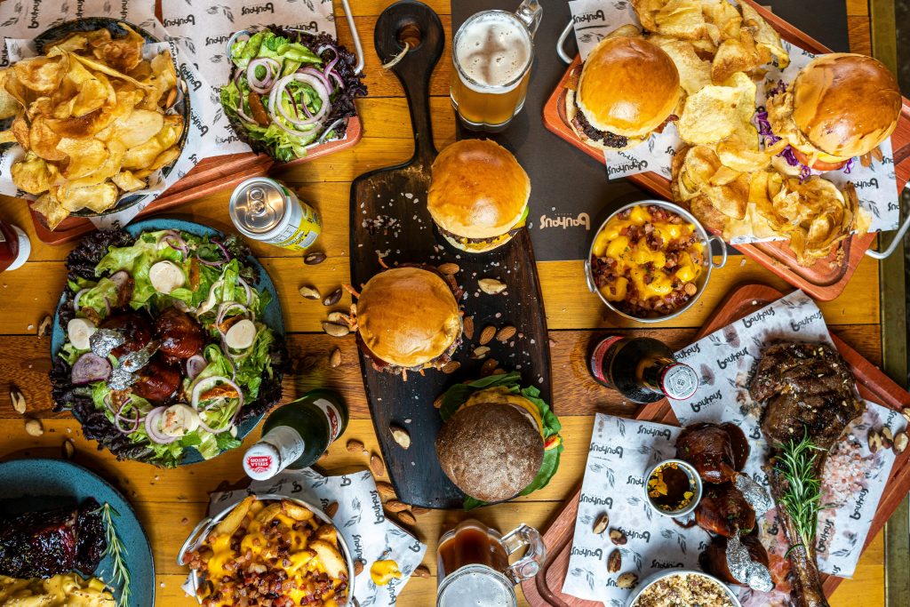 A lot of ultra-processed foods on a table. Photo by Fabio Alves.