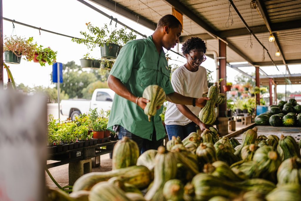 People check out produce at a local food stand. Photo by Repicturing Rural.