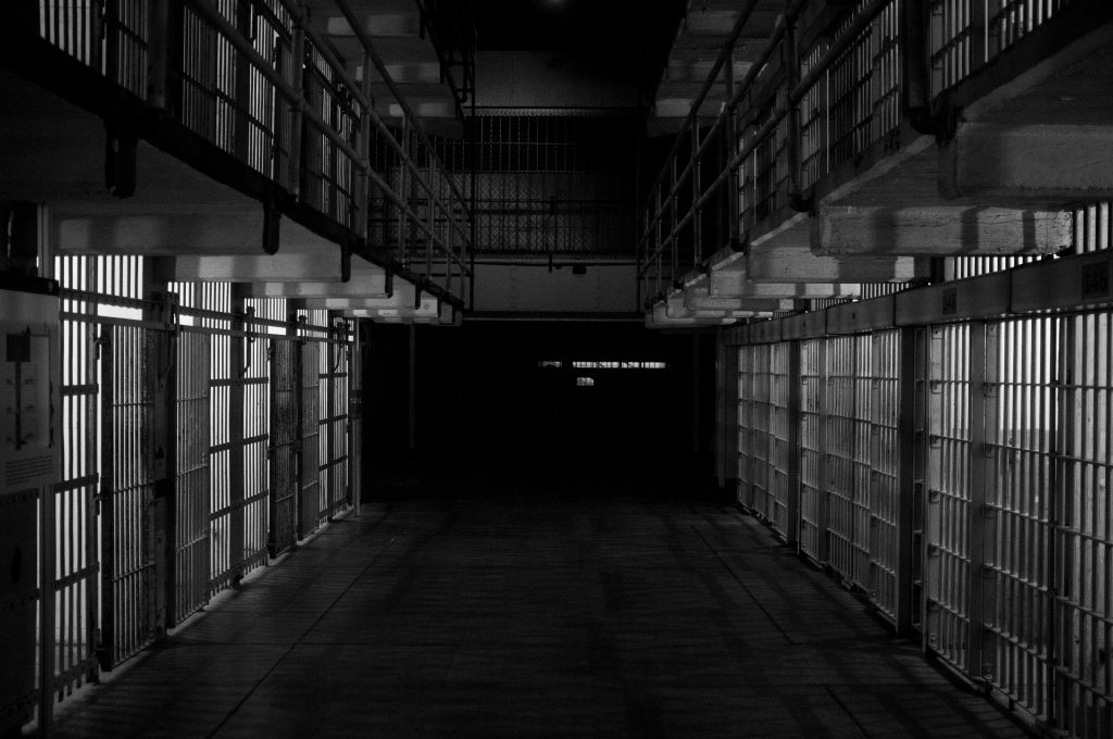Prison cells. Photo by Emiliano Bar on Unsplash.