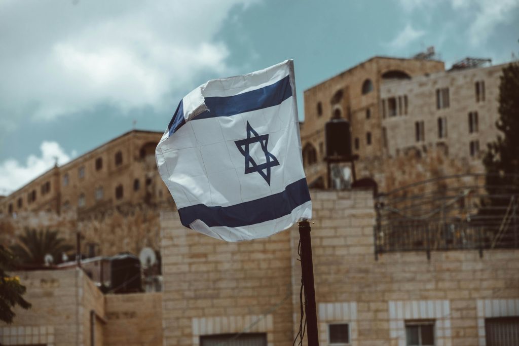 Israel's flag flies in Jerusalem. Photo by Taylor Brandon.